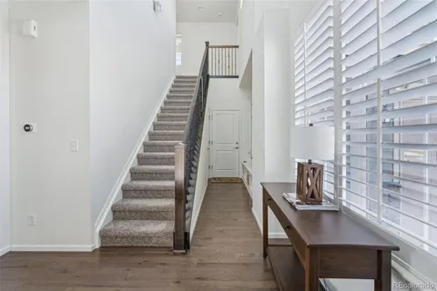 a kitchen with stainless steel appliances a stove refrigerator sink and cabinets