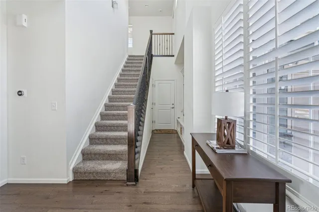 a kitchen with stainless steel appliances a stove refrigerator sink and cabinets