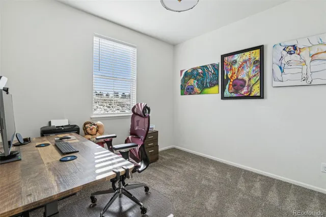 a view of a workspace with furniture