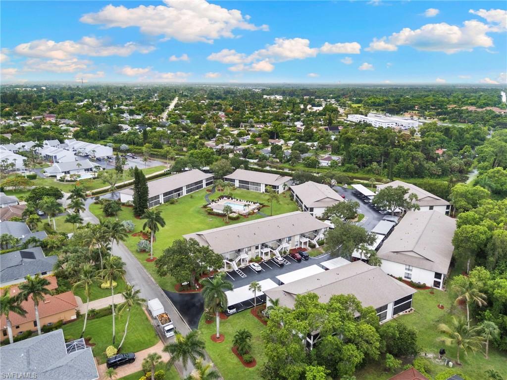 236 Pebble Beach Circle, Unit A202 Naples, FL 34113 - Photo 21 of 25 an aerial view of residential houses with outdoor space