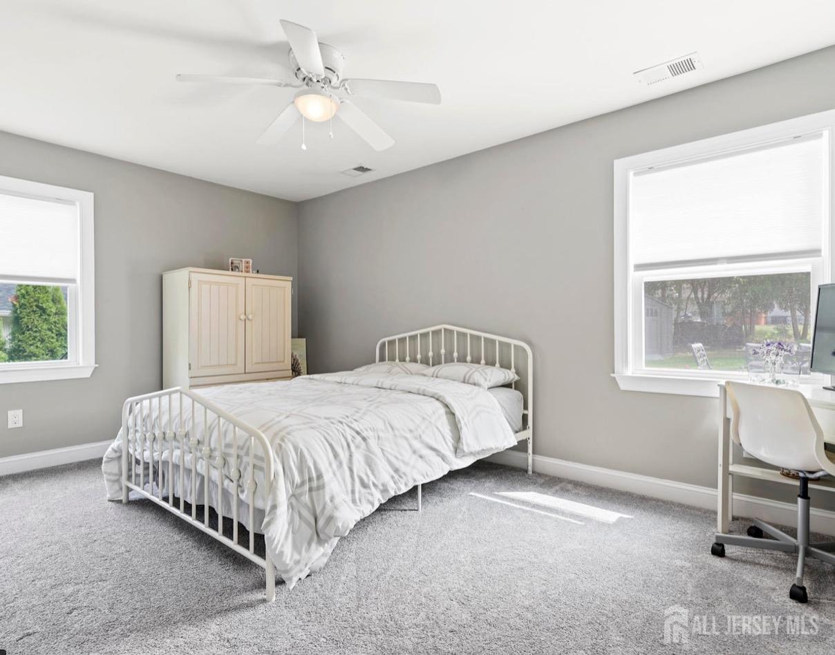 13 Crabtree Road Old Bridge, NJ 07747 - Photo 16 of 32 a bedroom with a bed a table and chair
