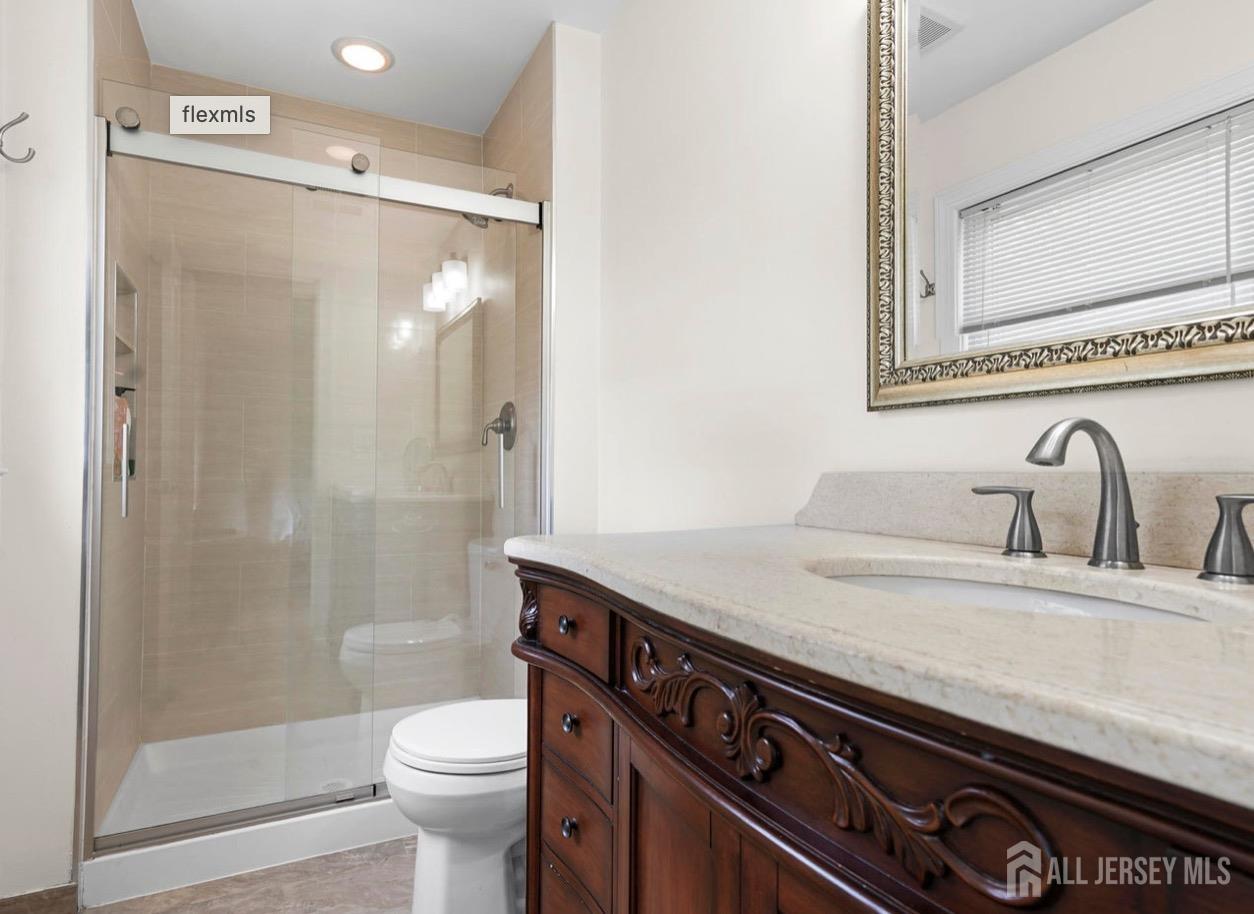 13 Crabtree Road Old Bridge, NJ 07747 - Photo 19 of 32 a bathroom with a sink a toilet and shower