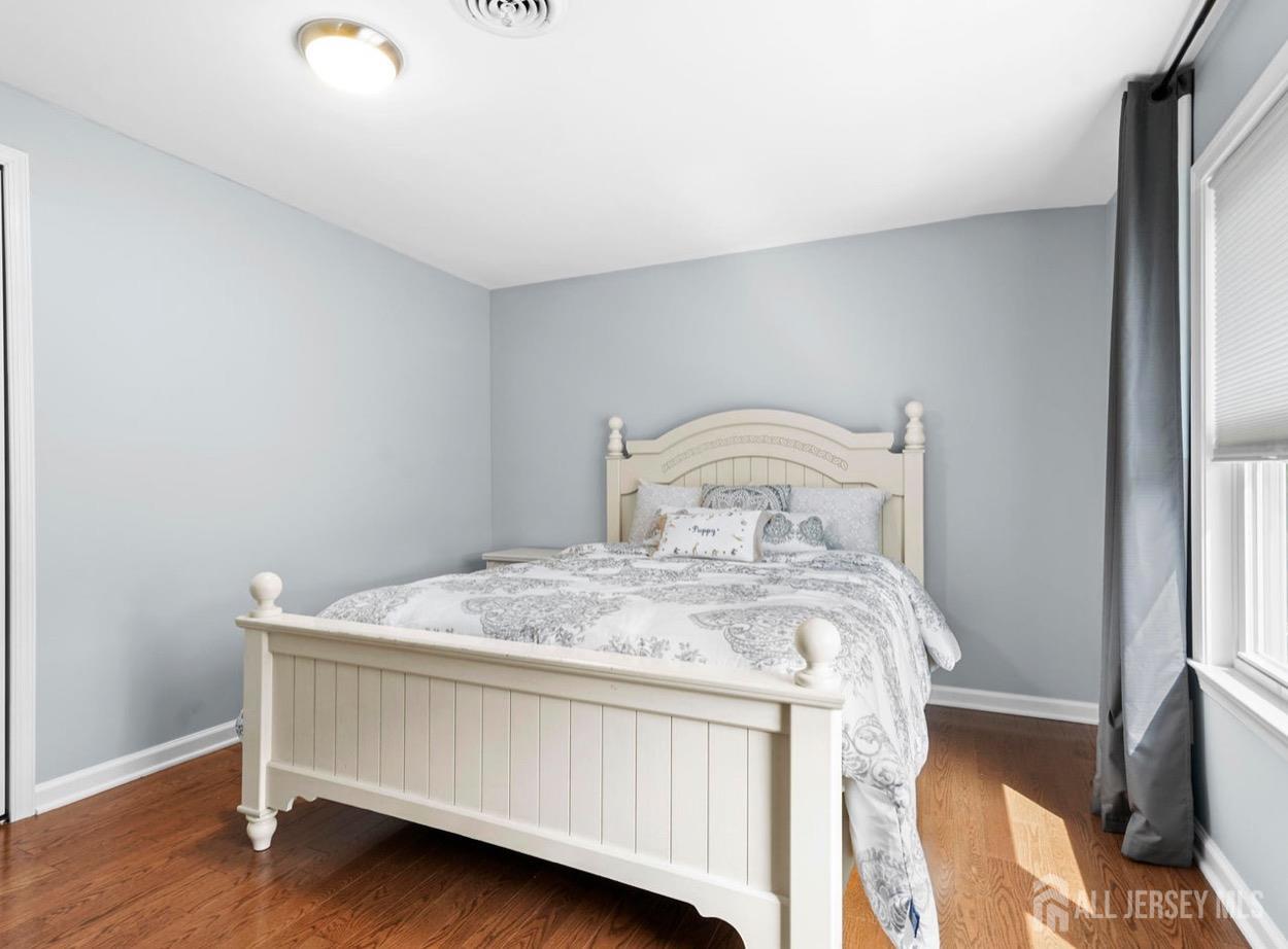 13 Crabtree Road Old Bridge, NJ 07747 - Photo 24 of 32 a bed sitting in a bedroom next to a window