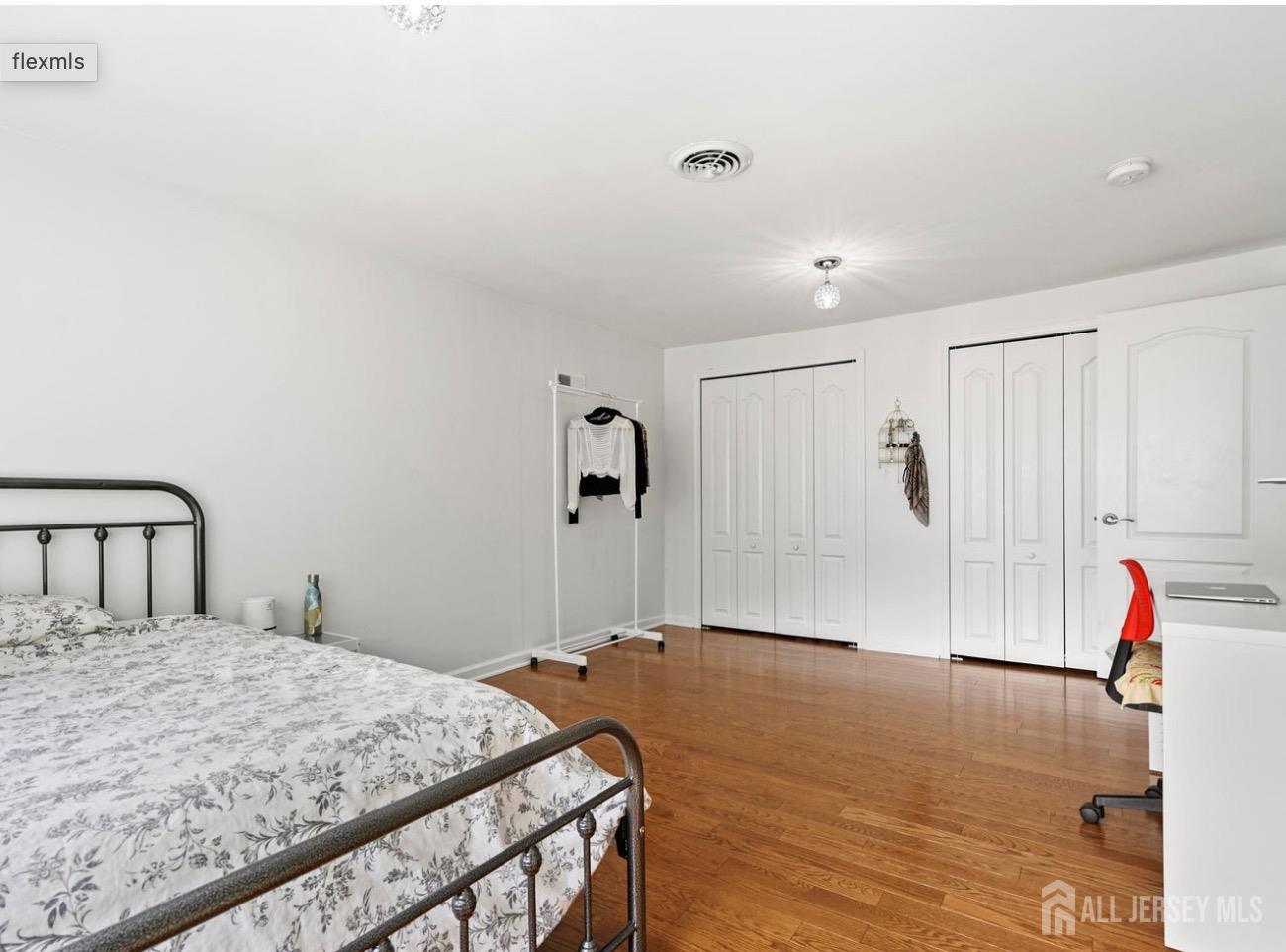 13 Crabtree Road Old Bridge, NJ 07747 - Photo 27 of 32 a bedroom with a bed and a wooden floor