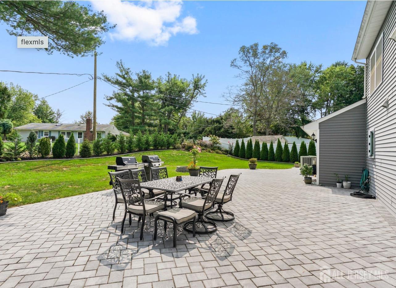 13 Crabtree Road Old Bridge, NJ 07747 - Photo 31 of 32 a view of a house with backyard sitting area and garden