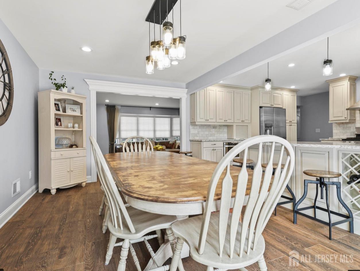 13 Crabtree Road Old Bridge, NJ 07747 - Photo 10 of 32 a view of a dining room with furniture and wooden floor