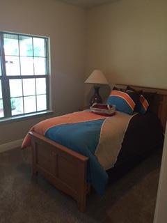 3636 Ranch Drive Crestview, FL 32539 - Photo 11 of 26 a bedroom with a bed and window