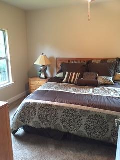 3636 Ranch Drive Crestview, FL 32539 - Photo 13 of 26 a bedroom with a bed and window