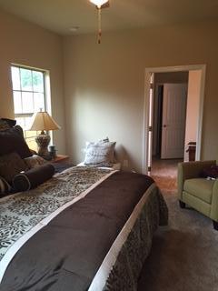3636 Ranch Drive Crestview, FL 32539 - Photo 14 of 26 a bedroom with a bed and a couch