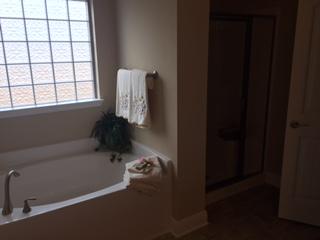 3636 Ranch Drive Crestview, FL 32539 - Photo 17 of 26 a bathroom with a bathtub and next to a window