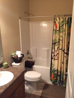 3636 Ranch Drive Crestview, FL 32539 - Photo 26 of 26 a bathroom with a sink a toilet and shower