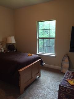 3636 Ranch Drive Crestview, FL 32539 - Photo 9 of 26 a bed sitting in a bedroom next to a window