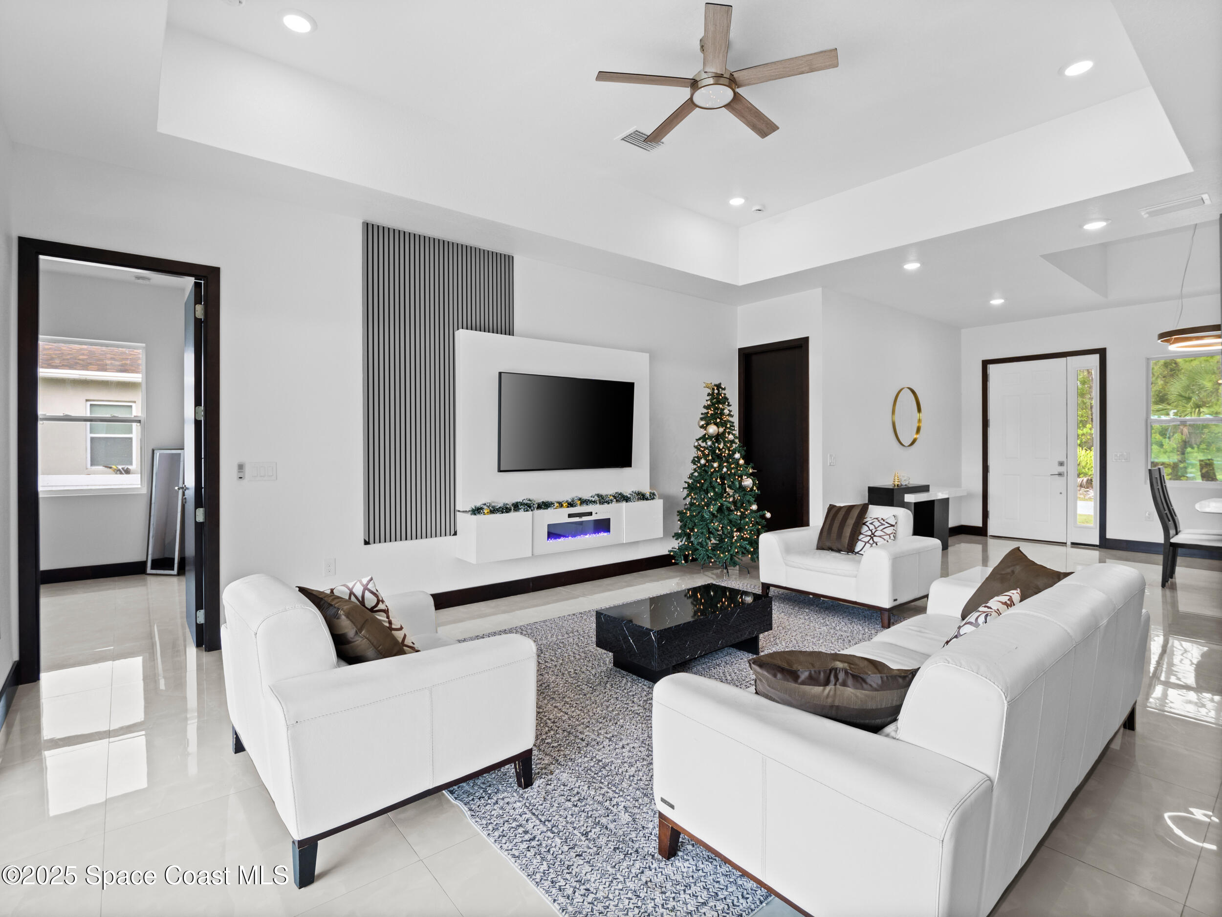 434 Flagler Road Southeast Palm Bay, FL 32909 - Photo 14 of 36 a living room with furniture and a flat screen tv