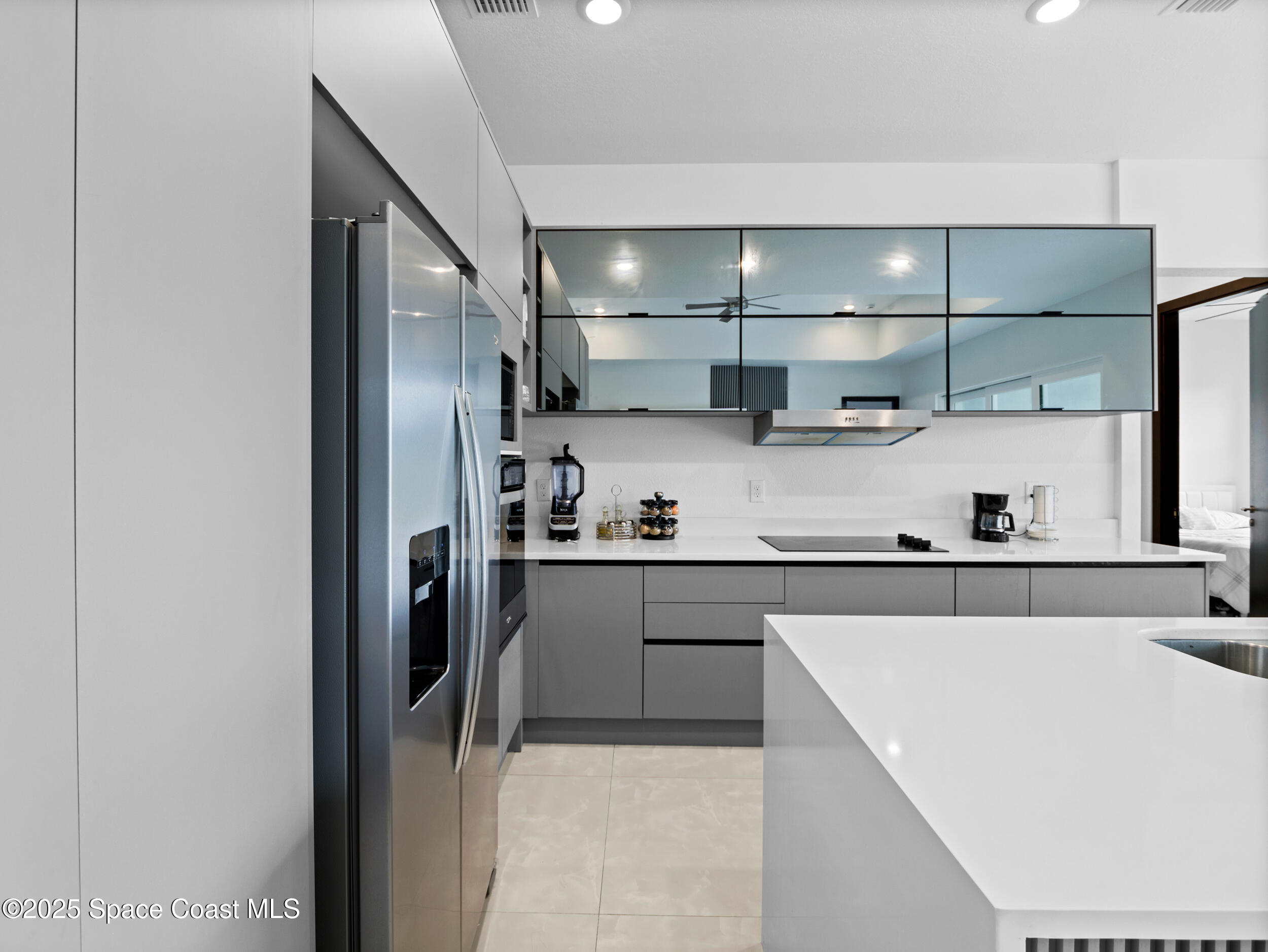 434 Flagler Road Southeast Palm Bay, FL 32909 - Photo 15 of 36 a kitchen with stainless steel appliances granite countertop a sink refrigerator and cabinets