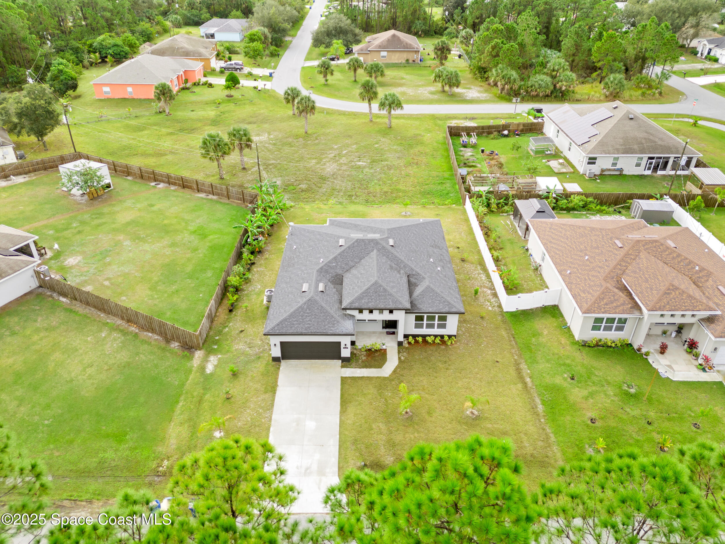 434 Flagler Road Southeast Palm Bay, FL 32909 - Photo 17 of 36 an aerial view of a house with a swimming pool