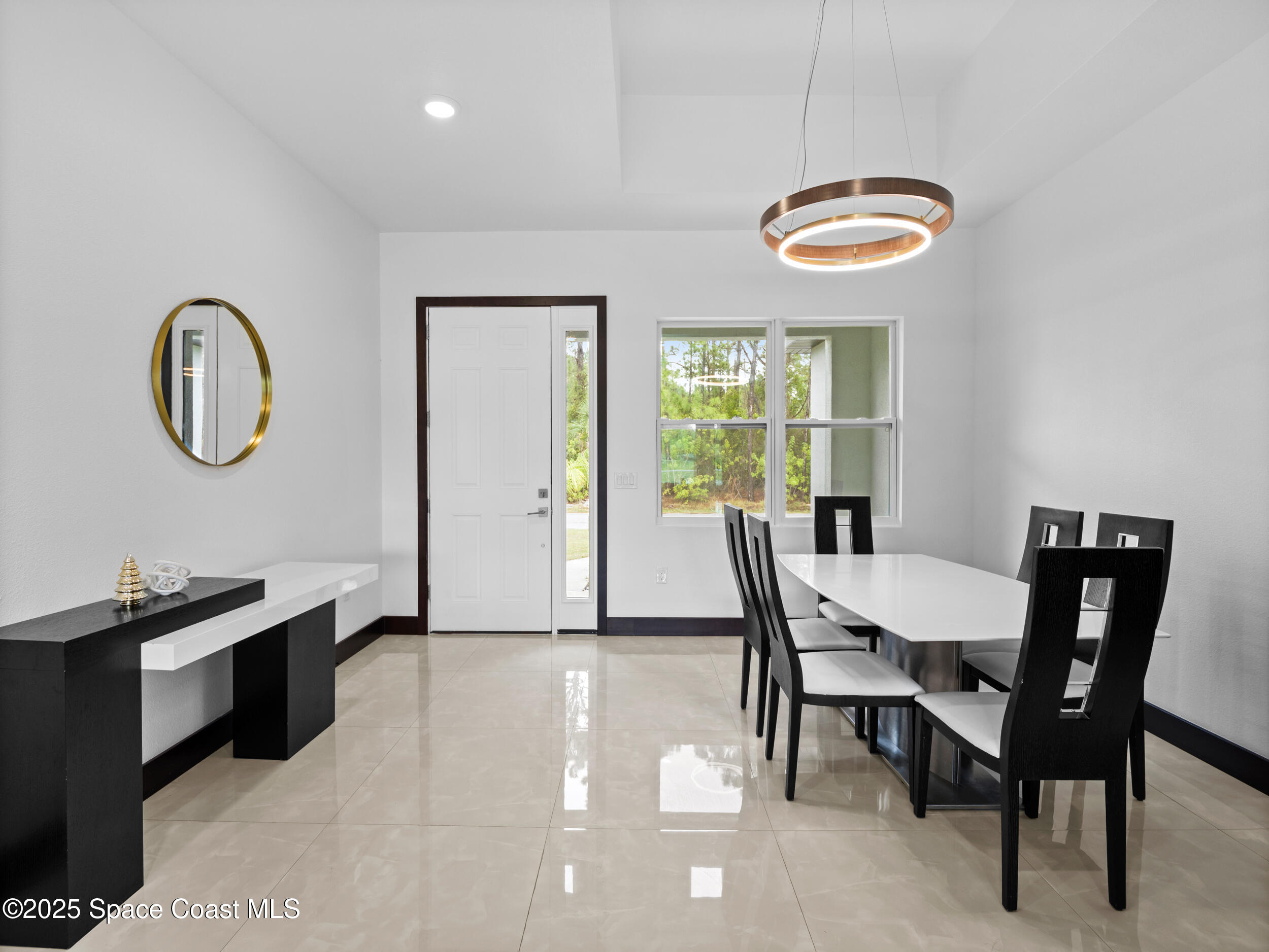 434 Flagler Road Southeast Palm Bay, FL 32909 - Photo 18 of 36 a view of a dining room with furniture window and wooden floor