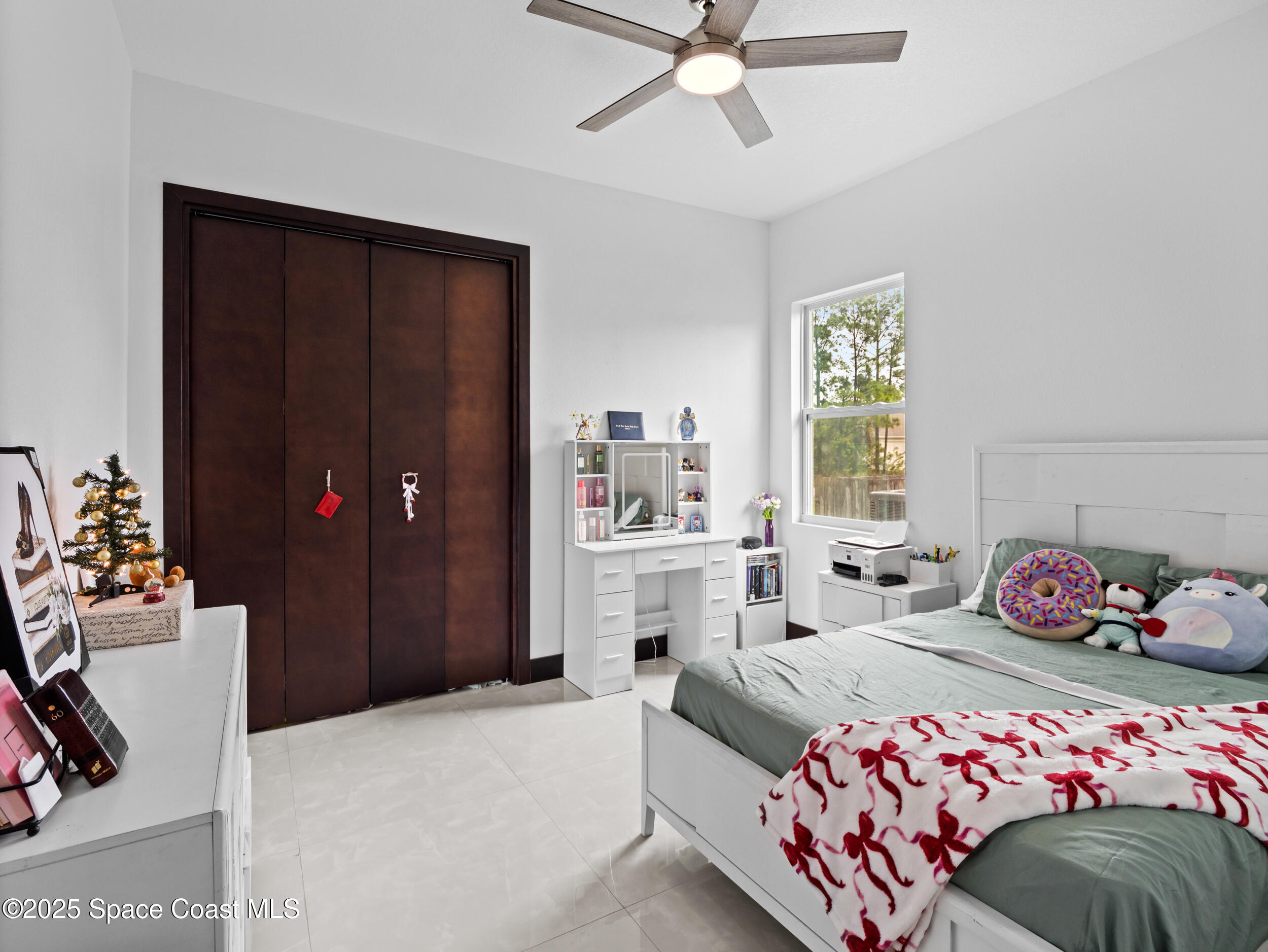 434 Flagler Road Southeast Palm Bay, FL 32909 - Photo 25 of 36 a bedroom with a bed and a window