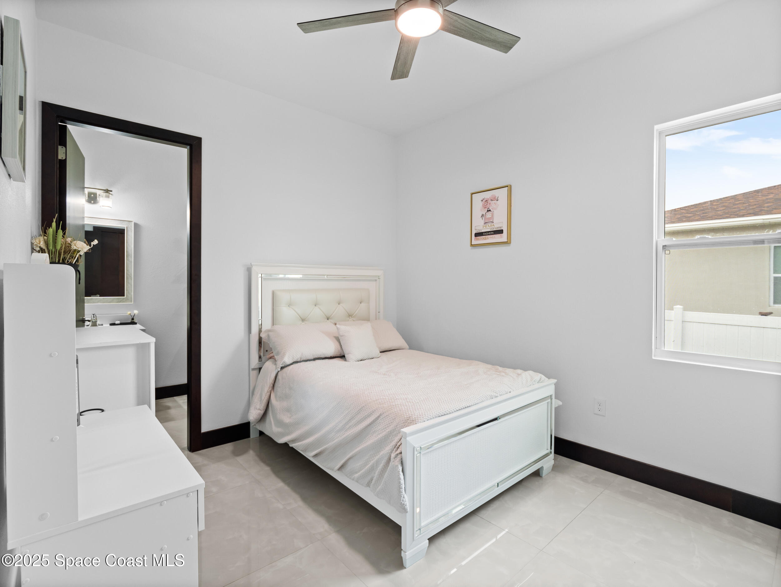 434 Flagler Road Southeast Palm Bay, FL 32909 - Photo 26 of 36 a bedroom with a bed and a window