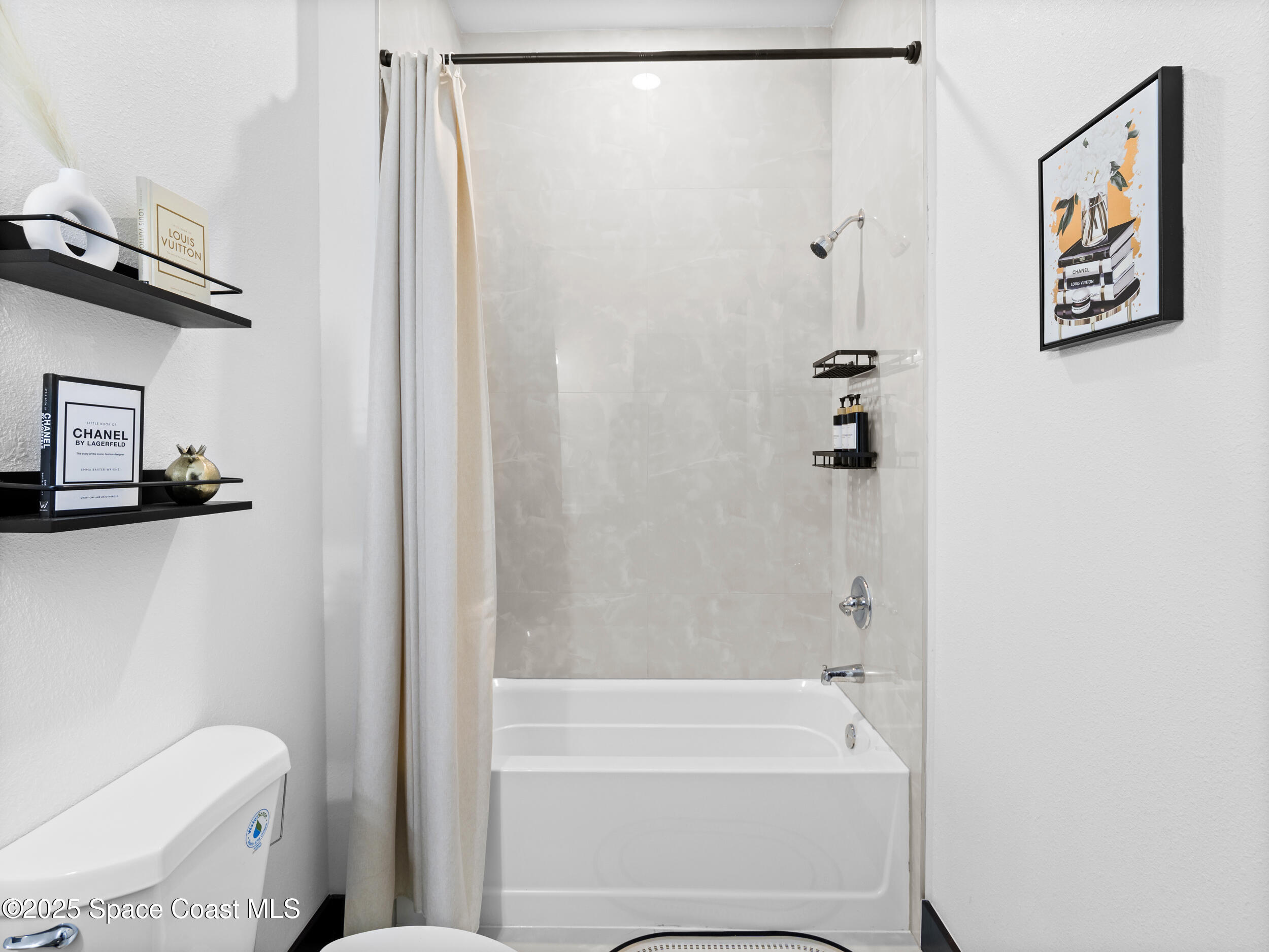 434 Flagler Road Southeast Palm Bay, FL 32909 - Photo 32 of 36 a bathroom with a shower and a toilet