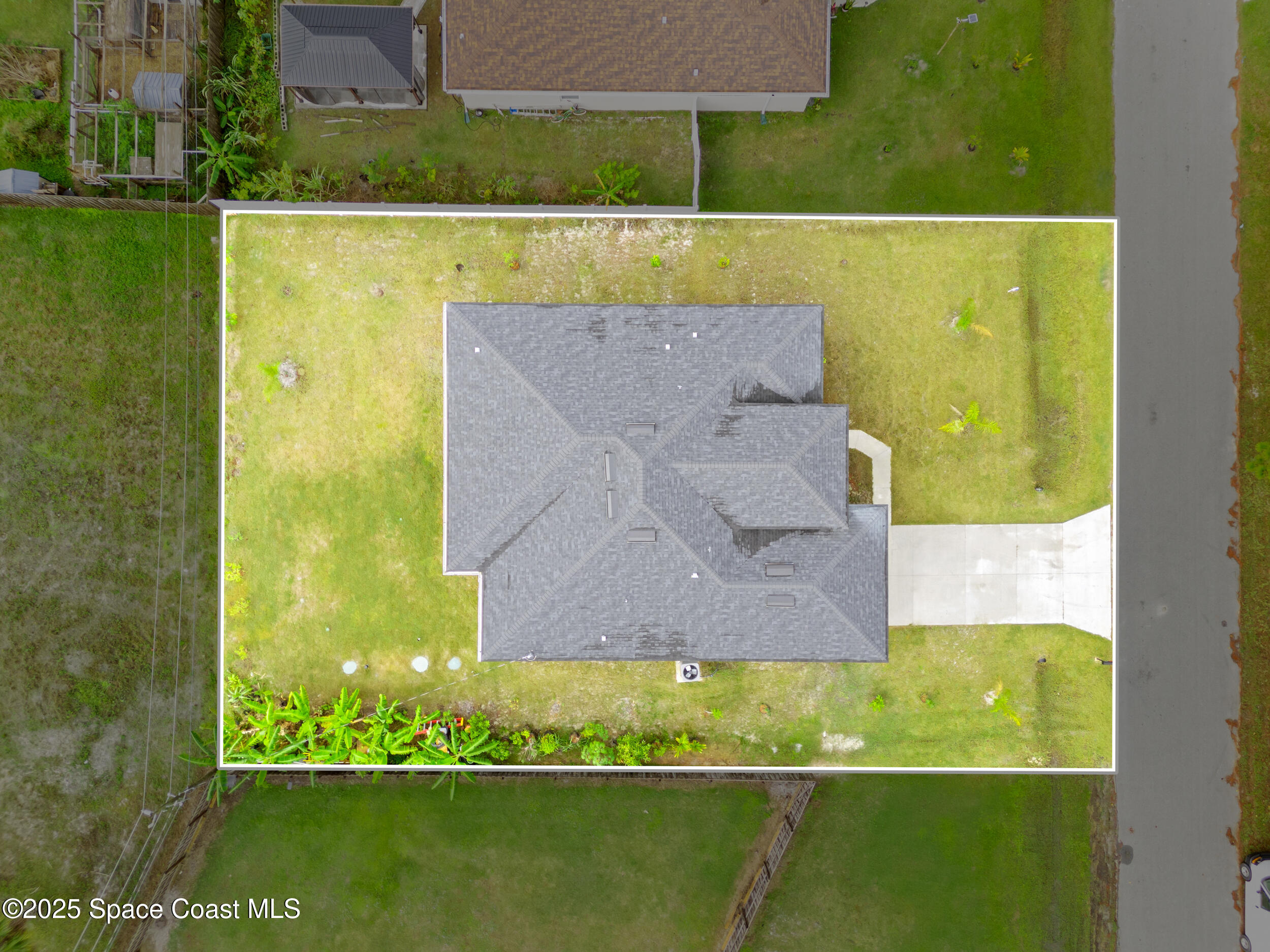 434 Flagler Road Southeast Palm Bay, FL 32909 - Photo 35 of 36 an aerial view of a residential houses with outdoor space and a lake view