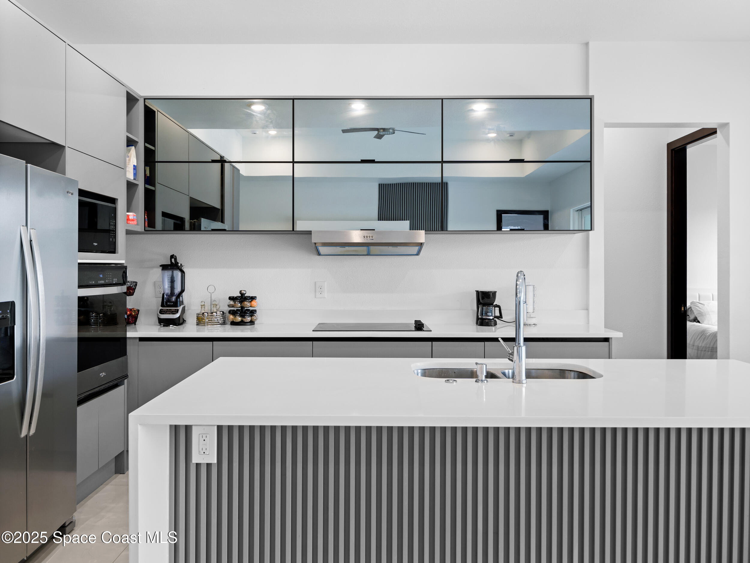 434 Flagler Road Southeast Palm Bay, FL 32909 - Photo 5 of 36 a kitchen with stainless steel appliances lots of counter space and a refrigerator