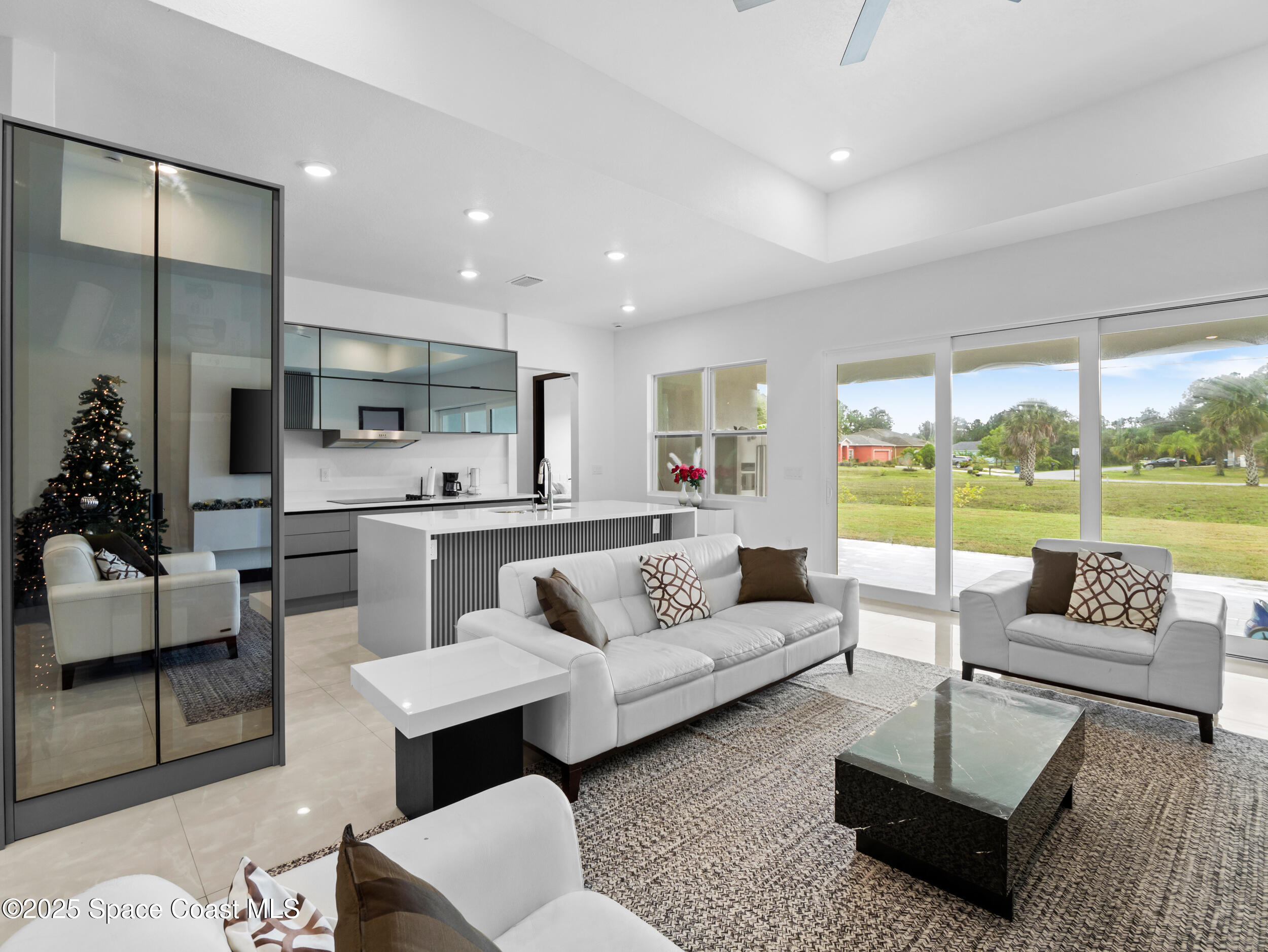 434 Flagler Road Southeast Palm Bay, FL 32909 - Photo 7 of 36 a living room with furniture and a large window