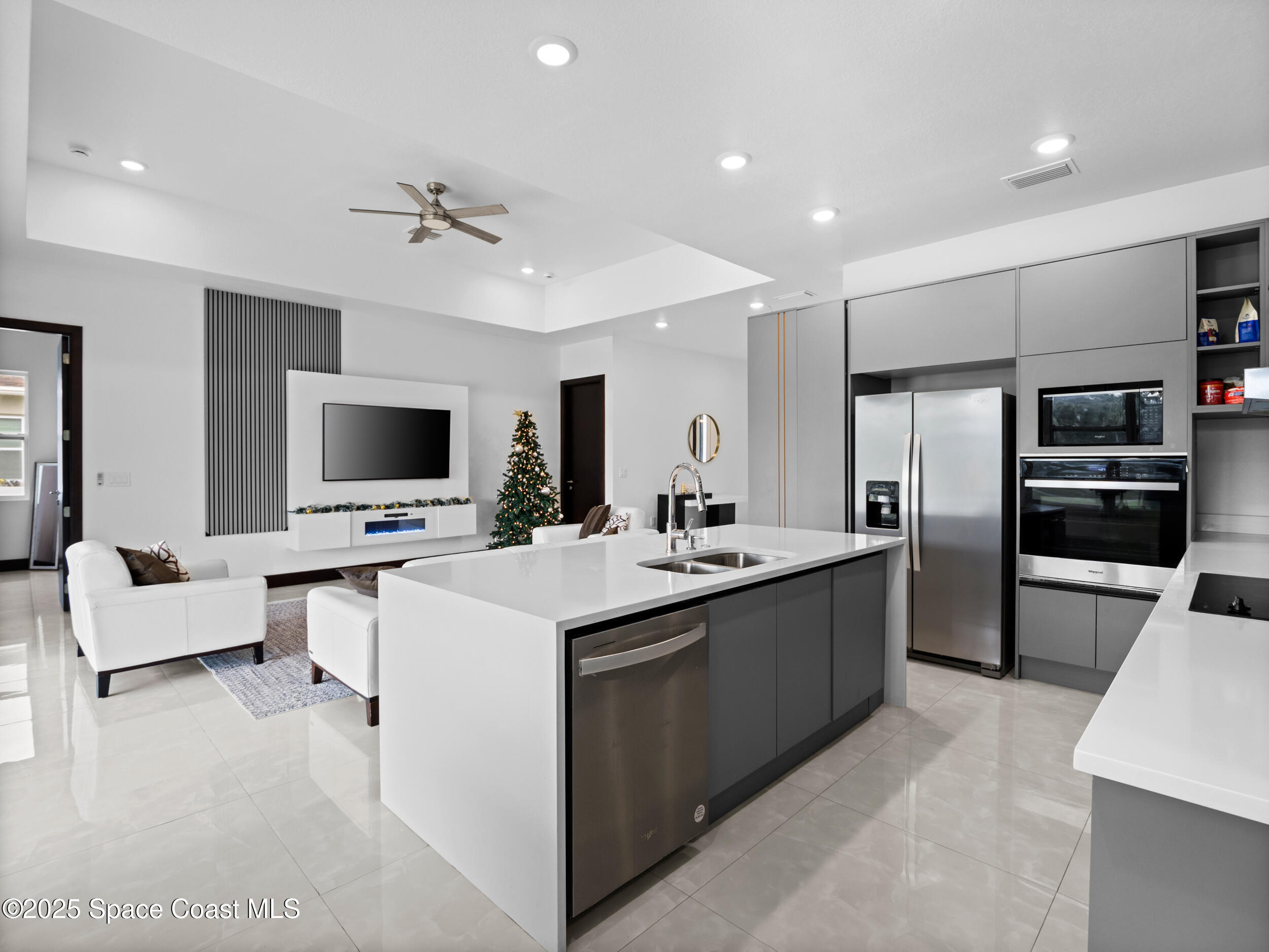 434 Flagler Road Southeast Palm Bay, FL 32909 - Photo 9 of 36 a large kitchen with cabinets and stainless steel appliances