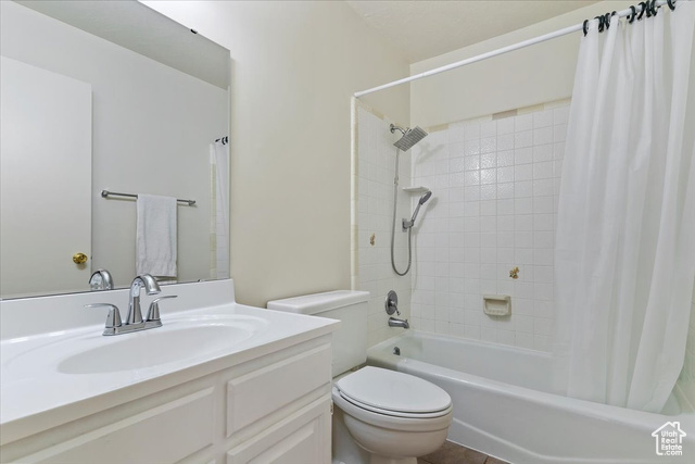 947 Canyon Road South, Unit 15 Ogden, UT 84404 - Photo 12 of 22 Full bathroom featuring shower / bath combination with curtain and vanity