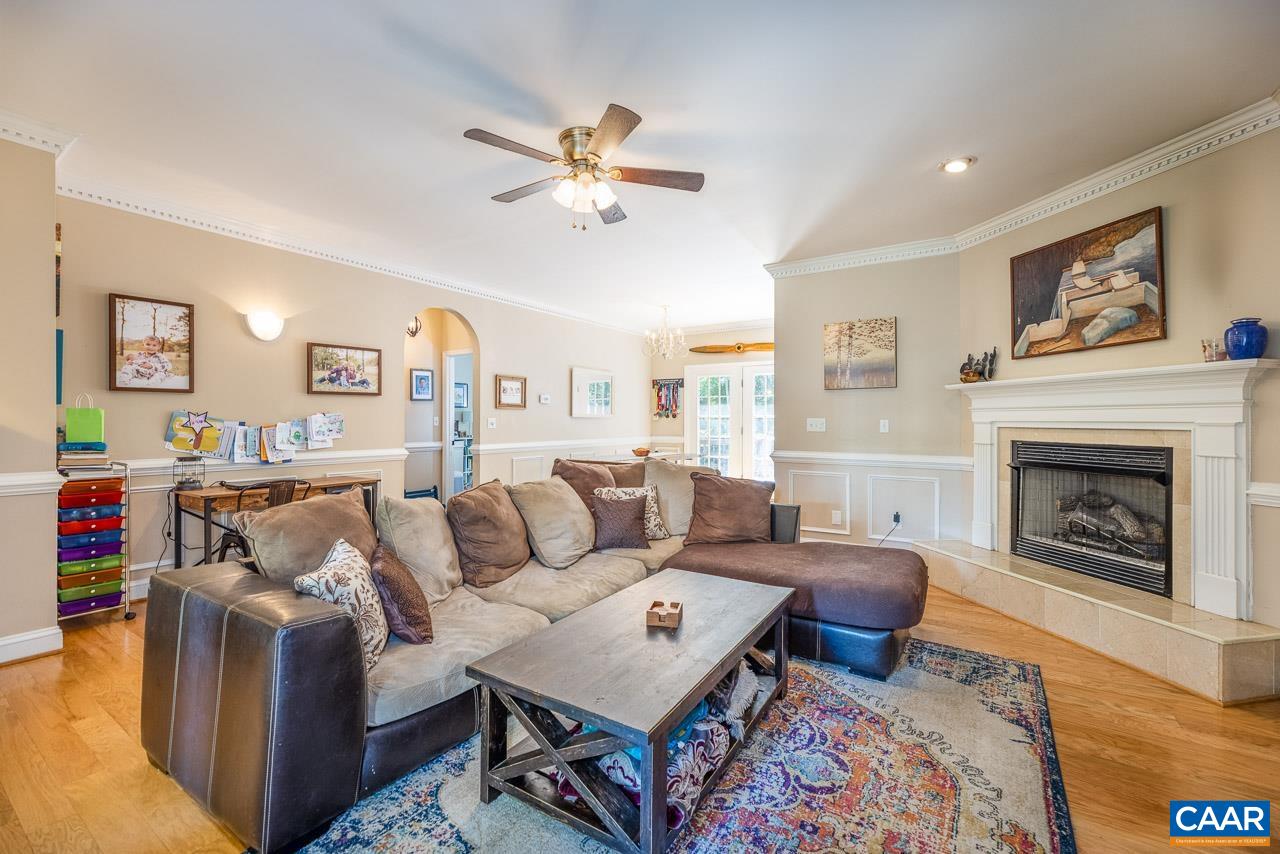 5 Tanglewood Road Palmyra, VA 22963 - Photo 4 of 17 a living room with furniture a fireplace and a flat screen tv