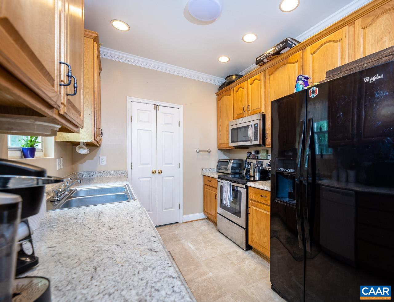 5 Tanglewood Road Palmyra, VA 22963 - Photo 6 of 17 a kitchen with stainless steel appliances granite countertop a refrigerator and a stove