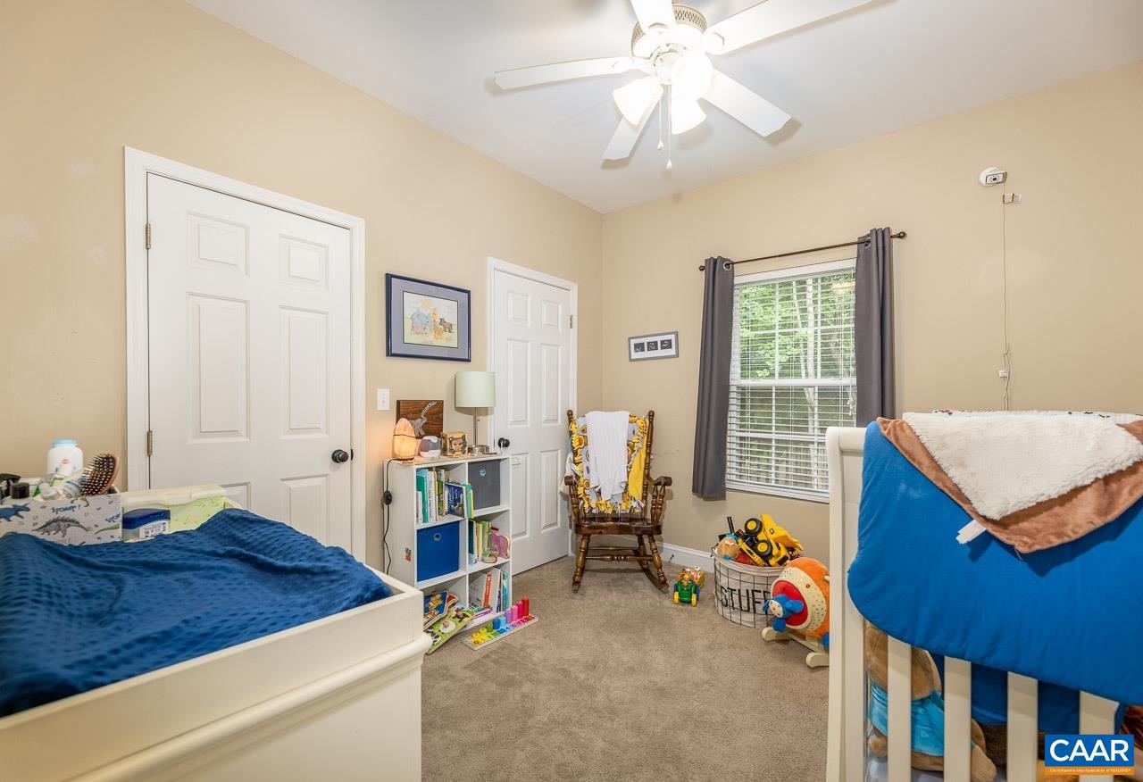 5 Tanglewood Road Palmyra, VA 22963 - Photo 10 of 17 a room with furniture and a chandelier