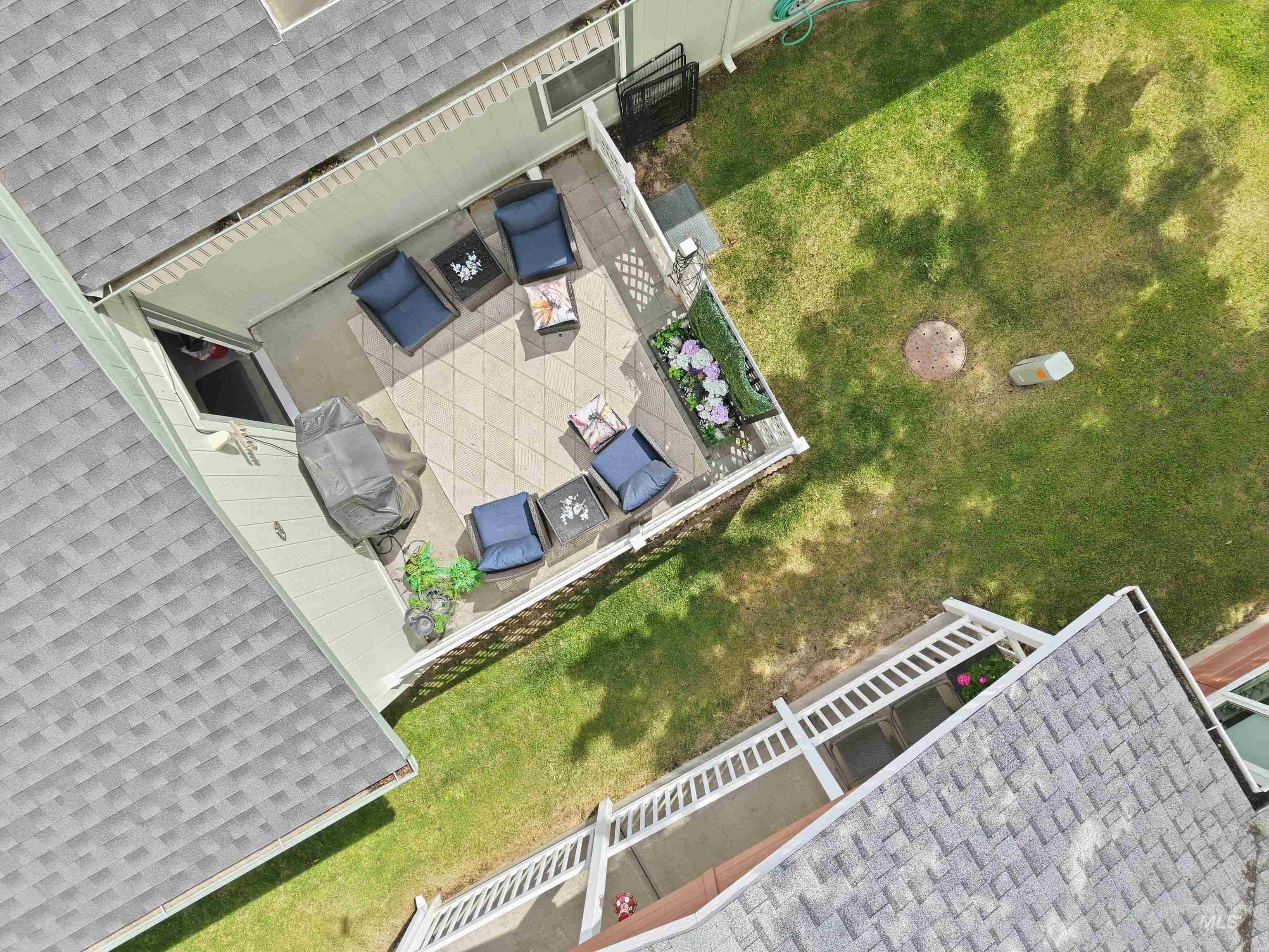 421 South Curtis Road, Unit 202 202 Boise, ID 83705 - Photo 36 of 41 Paved patio featuring a geometric tile pattern, surrounded by a low privacy fence