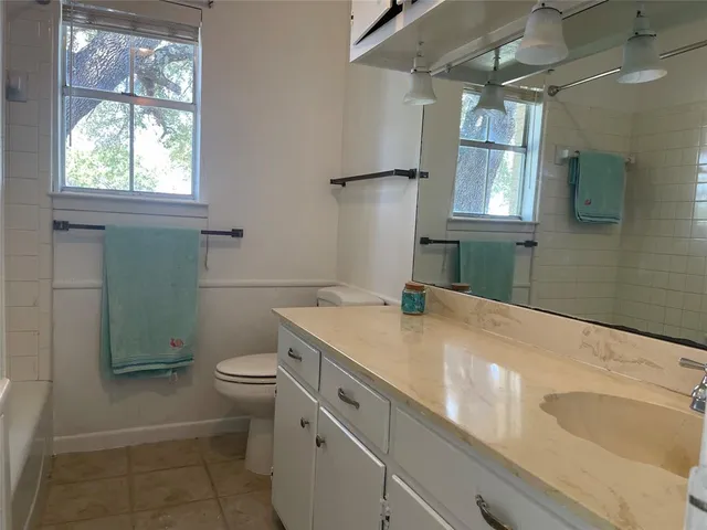 a view of empty room with a fireplace and cabinet