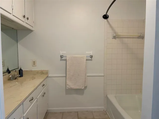 a kitchen with stainless steel appliances a sink and a refrigerator