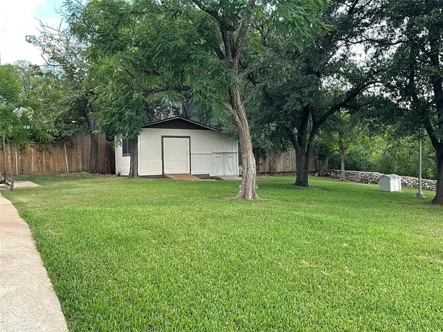 a house view with a backyard space