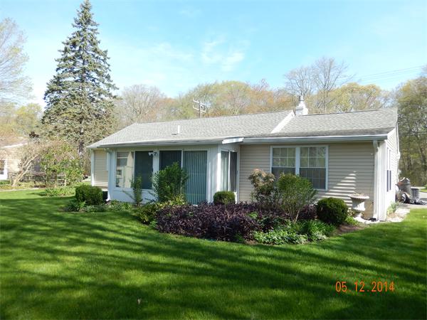 672 County Road Barrington, RI 02806 - Photo 12 of 13 a front view of a house with a yard and porch