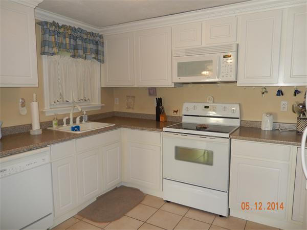 672 County Road Barrington, RI 02806 - Photo 5 of 13 a kitchen with cabinets appliances a sink and a counter top space