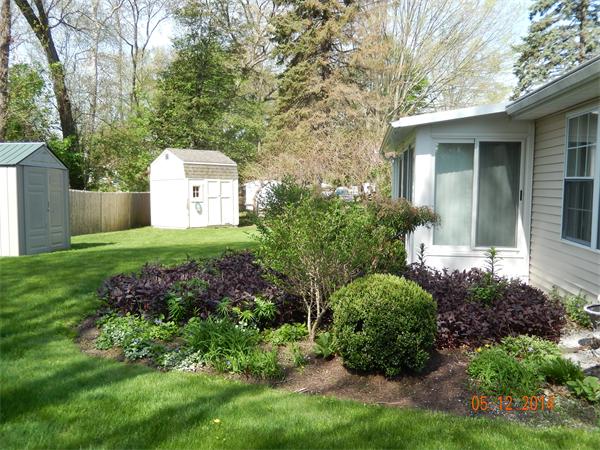 672 County Road Barrington, RI 02806 - Photo 10 of 13 a front view of a house with a yard and trees