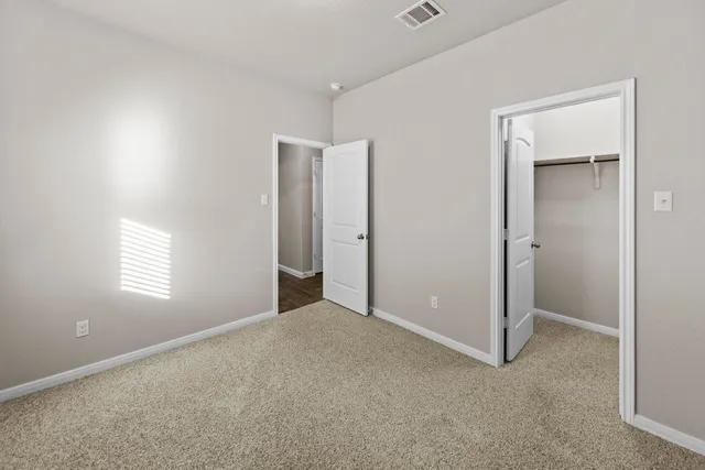 a view of empty room with windows