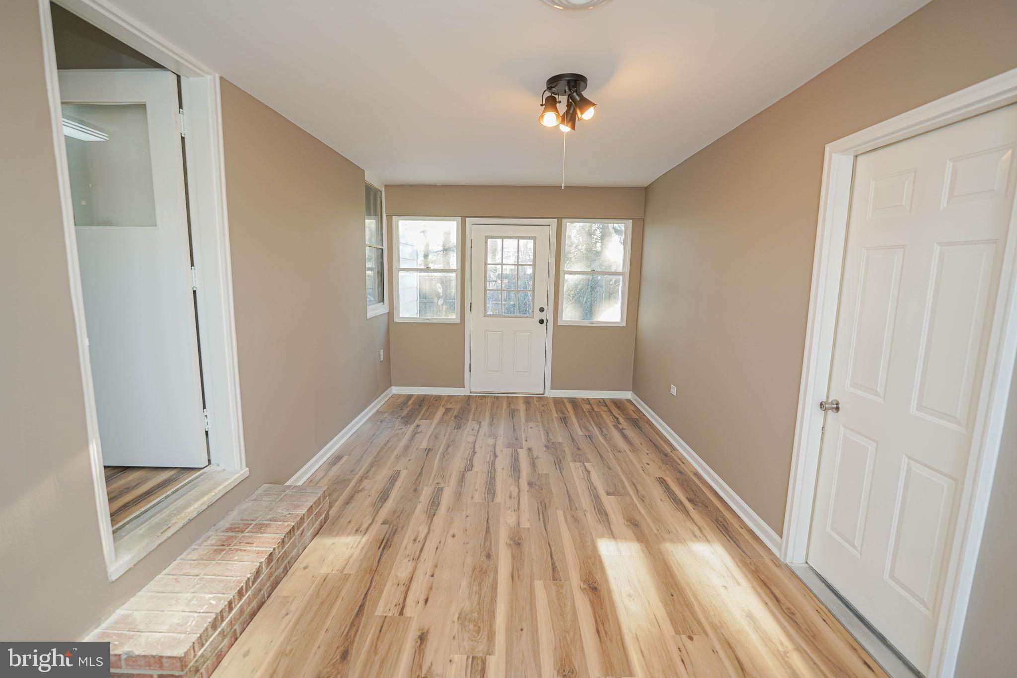 508 Race Street Vienna, MD 21869 - Photo 12 of 31 a view of empty room with wooden floor and fan