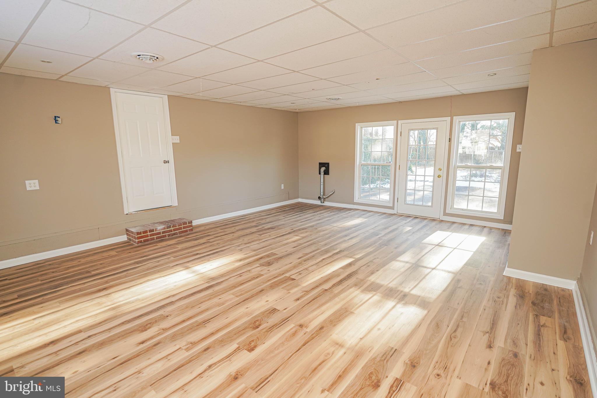 508 Race Street Vienna, MD 21869 - Photo 16 of 31 a view of an empty room with wooden floor and a window