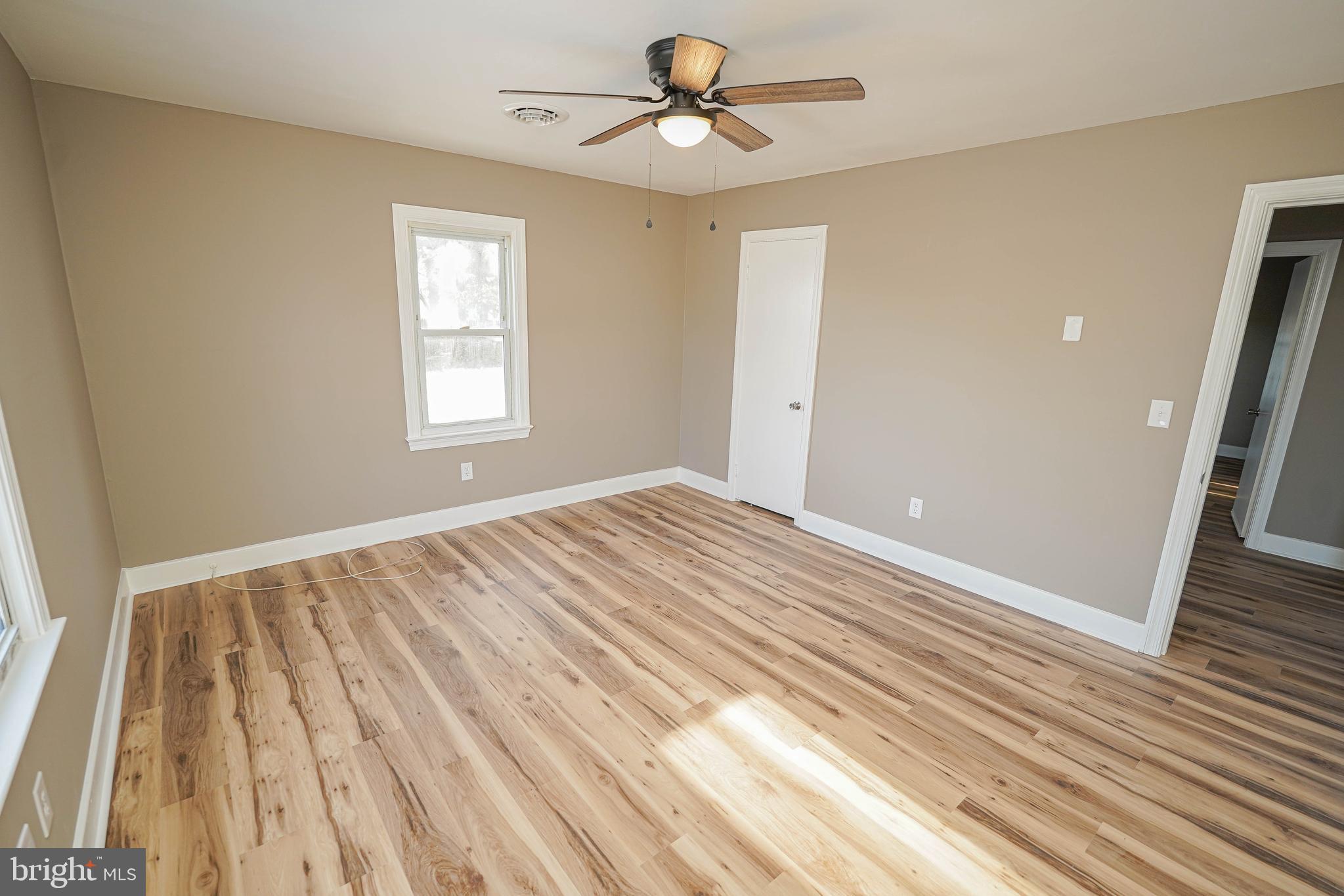 508 Race Street Vienna, MD 21869 - Photo 20 of 31 a view of empty room with wooden floor and fan