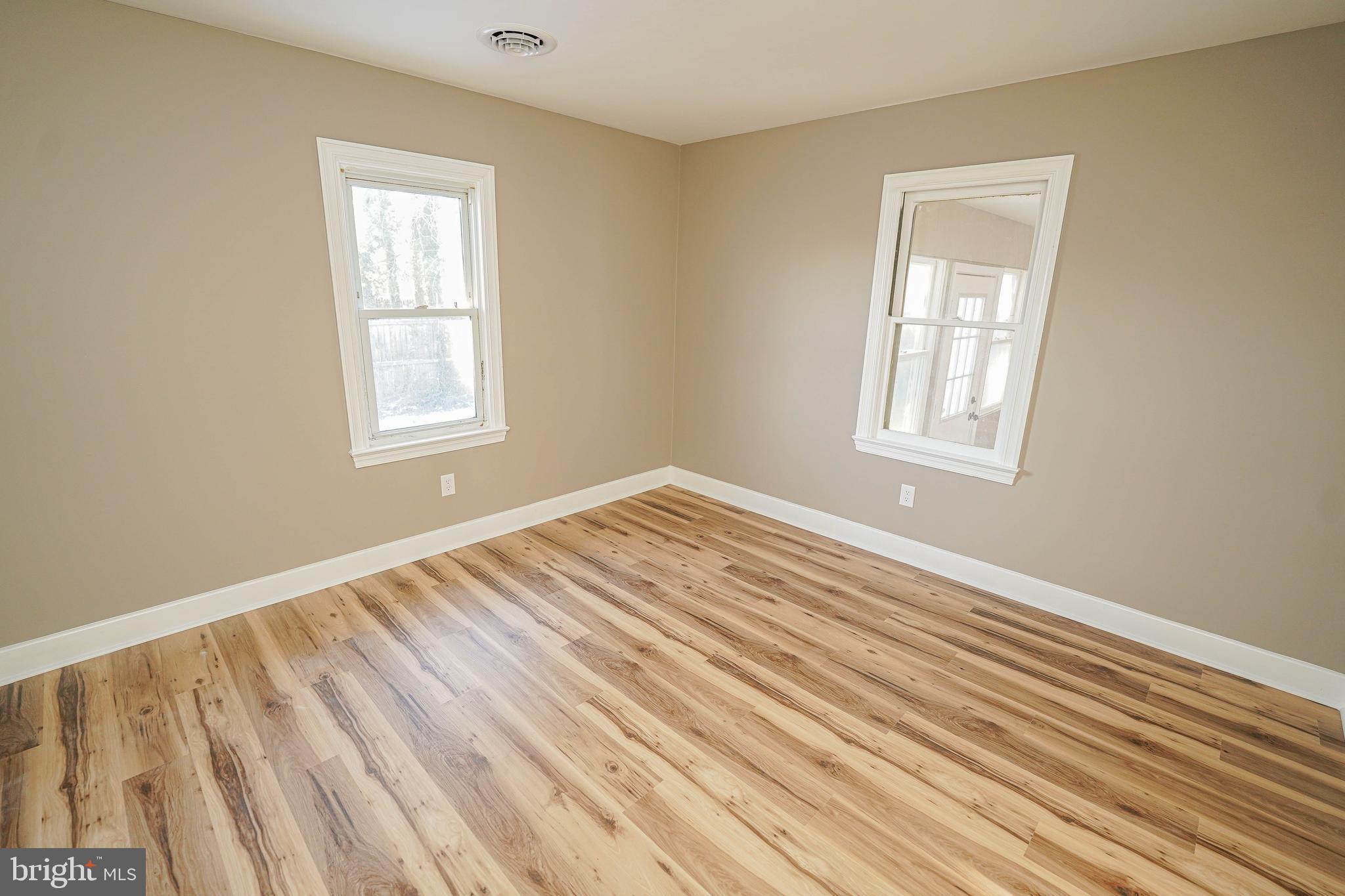 508 Race Street Vienna, MD 21869 - Photo 25 of 31 a view of an empty room with wooden floor and a window