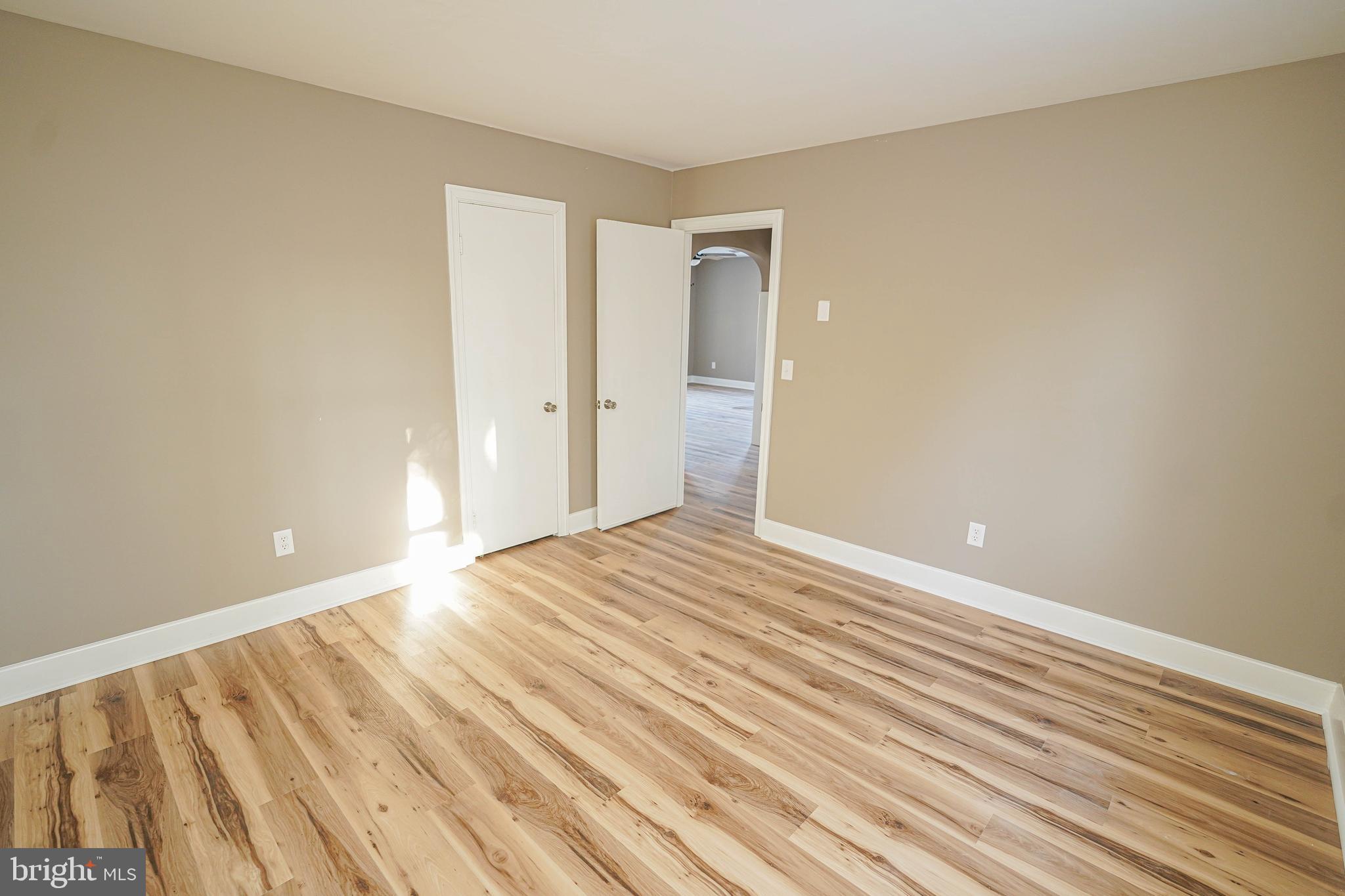 508 Race Street Vienna, MD 21869 - Photo 27 of 31 a view of an empty room with wooden floor