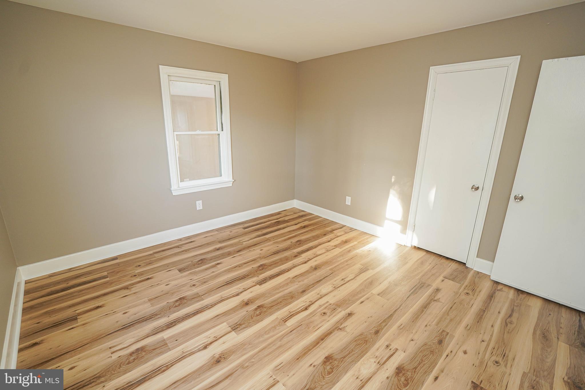 508 Race Street Vienna, MD 21869 - Photo 28 of 31 a view of empty room with wooden floor and fan