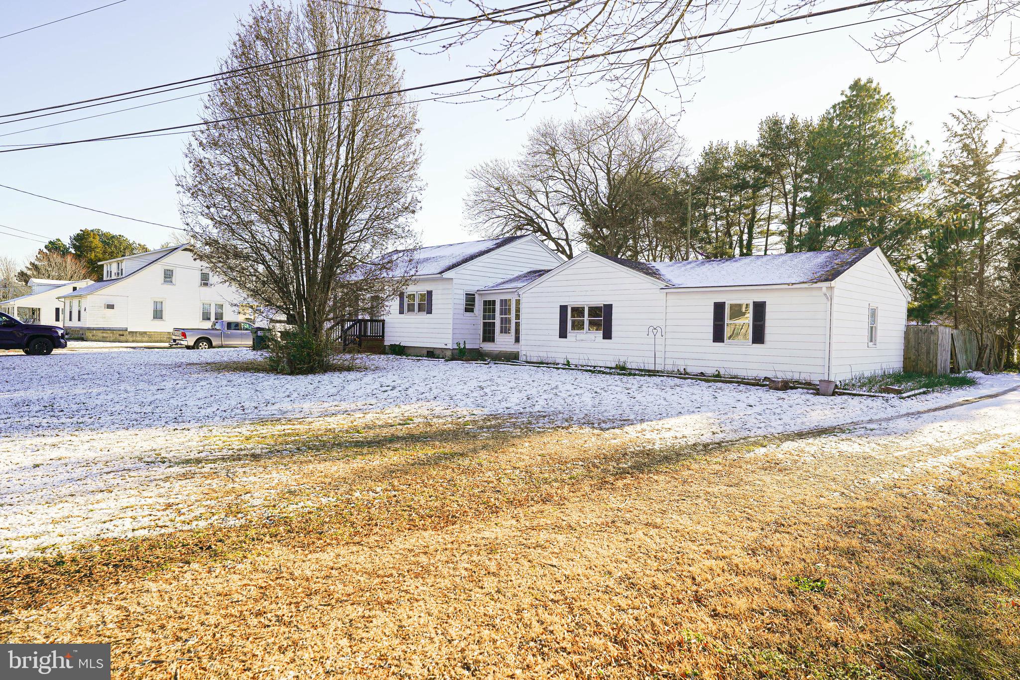 508 Race Street Vienna, MD 21869 - Photo 3 of 31 a view of a white house with a yard and large tree