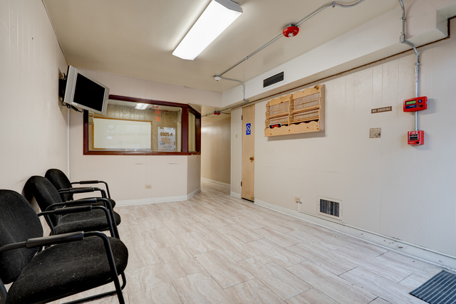 6905 Cermak Road Berwyn, IL 60402 - Photo 17 of 29 a view of a livingroom with wooden floor and windows