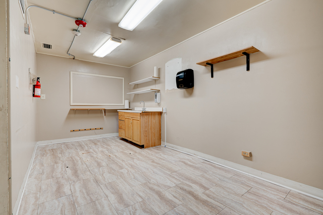 6905 Cermak Road Berwyn, IL 60402 - Photo 20 of 29 a view of storage and utility room with wooden floor