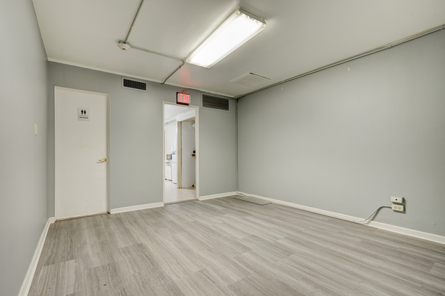 6905 Cermak Road Berwyn, IL 60402 - Photo 5 of 29 a view of an empty room with wooden floor