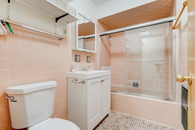 6905 Cermak Road Berwyn, IL 60402 - Photo 10 of 29 a bathroom with a sink a toilet and shower